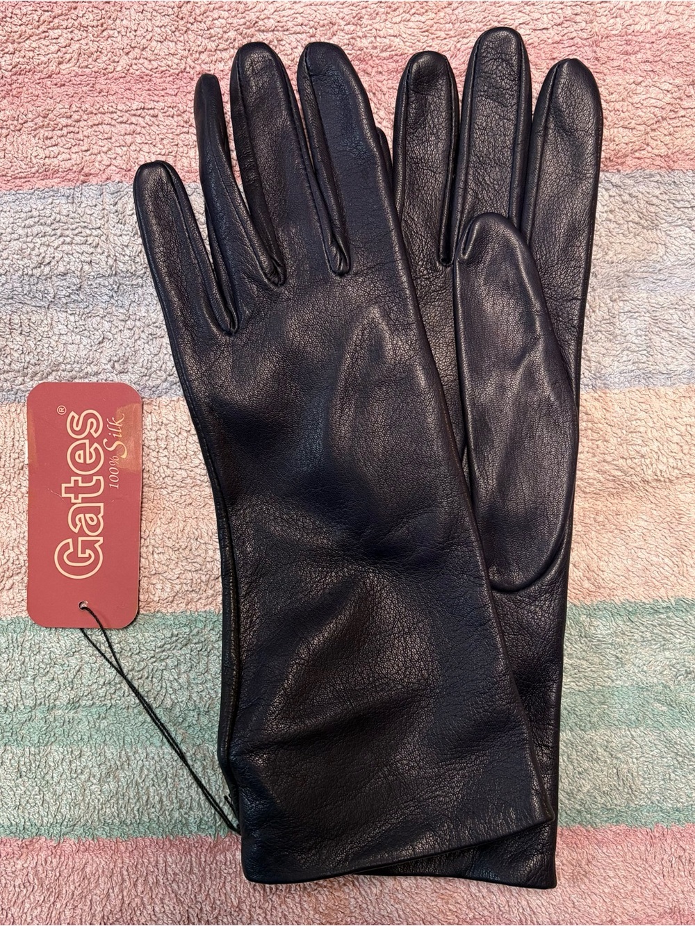 Gates genuine silk lined leather gloves.